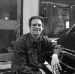 Tutor Nick Tomalin at the piano